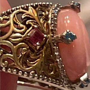 Pink Peruvian Opal ring set with blue apatite and rhodolite stones in gold over